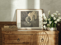 Crouching giant and two robed figures print in an oak frame on a farmhouse dresser beside white tulips
