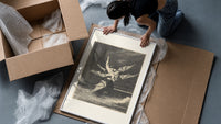 winged demon carrying nude figure framed print being unpacked from protective bubble wrap and a box