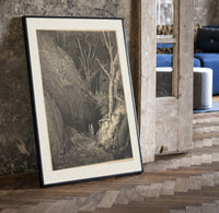 Two figures walking through dark forest print in a black frame leaning beside a vintage door on parquet