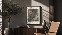 Two figures walking through dark forest poster framed above a fluted sideboard beside an olive tree