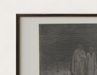 Close-up of the Two robed figures among buried heads print's dark wood frame corner and archival matte paper