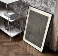 Two robed figures under starry sky poster in a black frame leaning beside a shelf in a raw-plaster loft