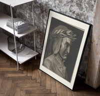 Man wearing laurel wreath in profile poster in a black frame leaning beside a shelf in a raw-plaster loft