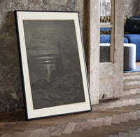 Two robed figures on cliff at night print in a black frame leaning beside a vintage door on parquet