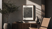 Two robed figures on cliff at night poster framed above a fluted sideboard beside an olive tree