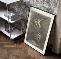 Winged demons flying above two robed figures poster in a black frame leaning beside a shelf in a raw-plaster loft