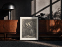 Black-framed Winged demons flying above two robed figures print on a moody console with designer coffee-table books