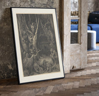 Harpies in dark forest print in a black frame leaning beside a vintage door on parquet