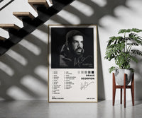 Drake Scorpion framed print on a staircase entryway wall beside a plant