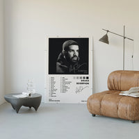 Drake Scorpion poster framed above a tan leather living-room couch