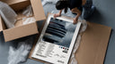 Drake Views framed print being unboxed from protective packaging
