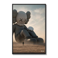 Giant KAWS Companion sculpture in desert poster framed on a white gallery wall