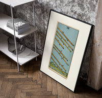 Eight flying wands over landscape poster in a black frame leaning beside a shelf in a raw-plaster loft