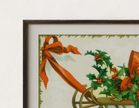 Close-up of the Christmas sled with holly and ribbon print's dark wood frame corner and archival matte paper