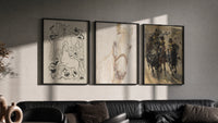 Horses and mounted cavalry soldiers triptych in three black frames on a grey wall above a leather sofa