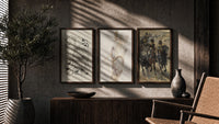 Horses and mounted cavalry soldiers triptych in three walnut frames above a sideboard in a warm room
