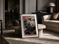 Woman on bicycle with tennis racket print in a black frame leaning on a travertine table in a sunlit lounge