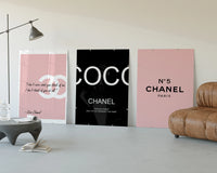 Chanel Wall Art Set three-panel set displayed beside a brown leather sofa
