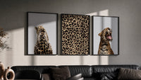 Leopard Print Wall Art Set triptych in three black frames on a grey wall above a leather sofa
