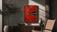 Fish Smoking a Cigarette poster framed above a fluted sideboard beside a potted tree