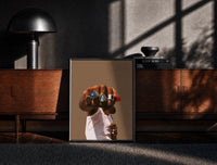 Black-framed Fist with a Blue Gemstone Ring print on the floor in front of a dark wooden console