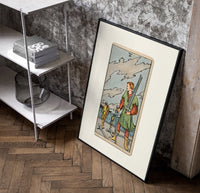 Man collecting swords by shore poster in a black frame leaning beside a shelf in a raw-plaster loft