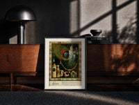 Black-framed Oriental woman with peacock feather print on a moody console with designer coffee-table books
