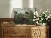 Impressionist flower garden with house print in an oak frame on a farmhouse dresser beside white tulips