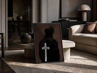 Forgiven Cross Hoodie print on the floor, leaning against a travertine table