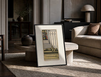 Effigy of knight with three swords print in a black frame leaning on a travertine table in a sunlit lounge