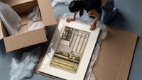 Effigy of knight with three swords framed print being unpacked from protective bubble wrap and a box