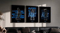 Black KAWS Companion framed poster set of 3 with blue script typography triptych in three black frames on a grey wall…