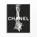 Framed Chanel black and white fashion poster with bold white CHANEL typography and editorial figure in open shirt