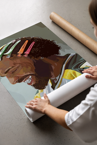Woman unrolling the Drake colorful hair clips portrait print across a grey concrete floor
