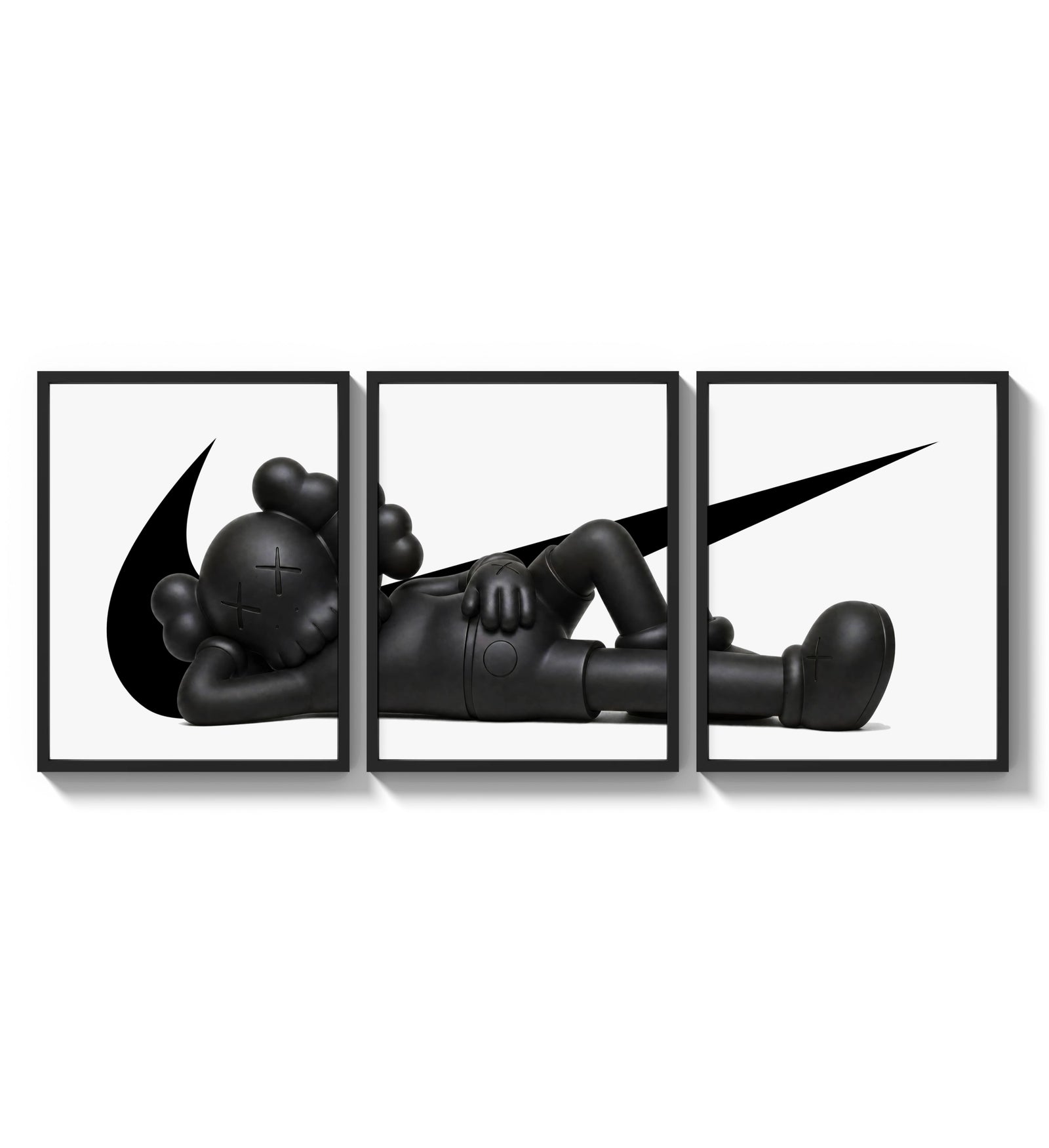 Reclining black KAWS Companion framed poster set of 3 with swoosh marks three-panel set arranged as a triptych on a…