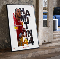 Lewis Hamilton 44 Ferrari red framed F1 poster with cut-out type print in a black frame leaning beside a vintage door on…
