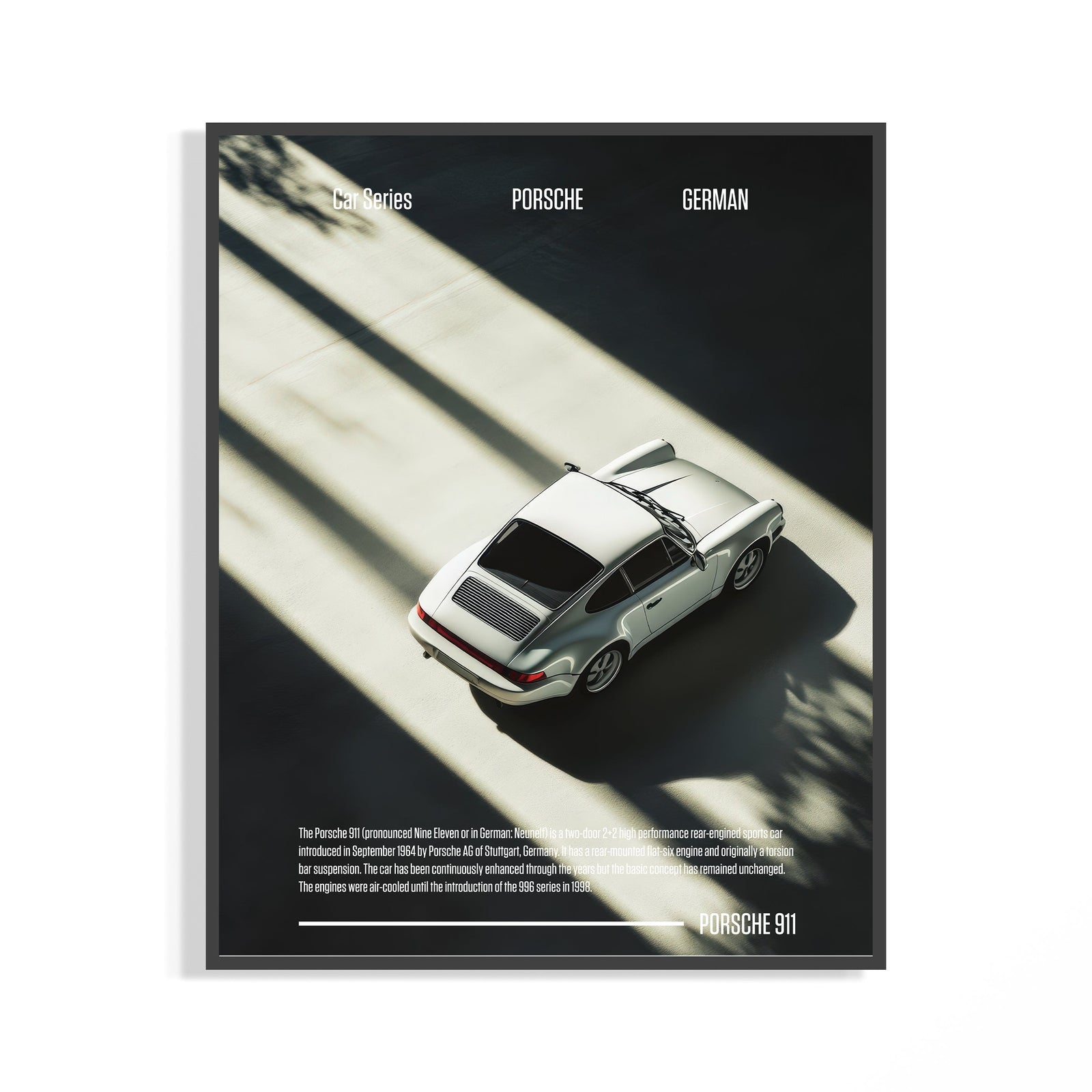 Framed Porsche 911 poster showing an overhead silver classic coupe in dramatic shadow and light