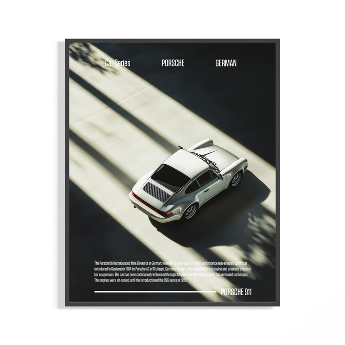 Framed Porsche 911 poster showing an overhead silver classic coupe in dramatic shadow and light