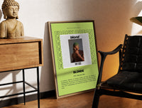 Brass-framed Man covering face album cover print leaning in a warm styled corner by a sculpture
