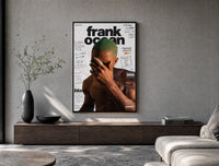 Frank Ocean with green hair poster framed above a wood console in a concrete-wall living room