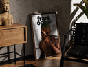 Walnut-framed Frank Ocean with green hair print leaning against a sunlit rustic brick wall