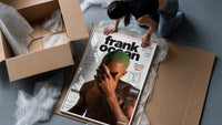 Frank Ocean with green hair framed print being unpacked from protective bubble wrap and a box