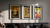 Vintage French aperitif advertisements trio triptych in three black frames on a grey wall above a leather sofa