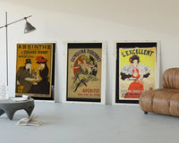 Vintage French aperitif advertisements trio three-panel set displayed beside a brown leather sofa