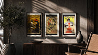 Vintage French aperitif advertisements trio triptych in three walnut frames above a sideboard in a warm room