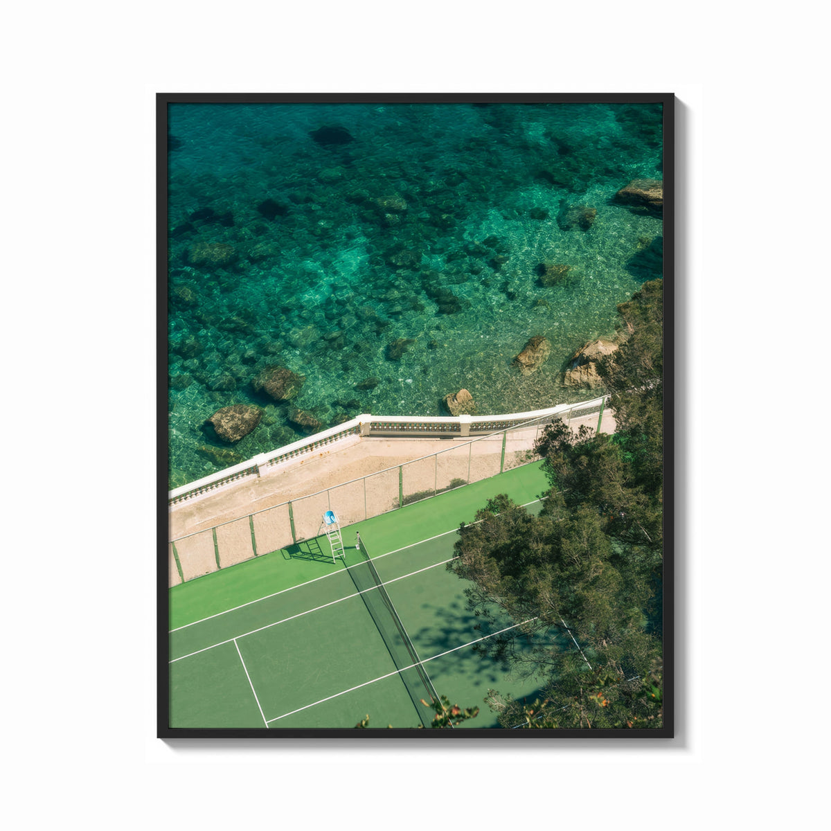 Framed Seaside tennis court by ocean print shown as a bold statement piece on a clean gallery wall