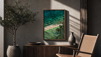 Seaside tennis court by ocean poster framed above a fluted sideboard beside an olive tree