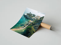 Rolled Cliffside coastal luxury villa estate poster beside its crush-resistant kraft shipping tube