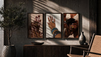 French Tips and Painted Nails Set of 3 in walnut frames above a sideboard in a warm room