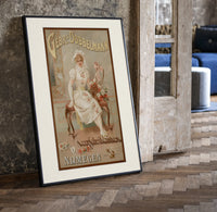 Elegant woman in white dress print in a black frame leaning beside a vintage door on parquet